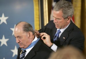 FILE -In this Sept. 23, 2005 file photo, President Bush presents the Medal of Honor to Cpl. Tibor Rubin, in the East Room at the White House. Rubin, a Hungarian-born Holocaust survivor who joined the U.S. Army after his liberation from the Nazis and earned the Medal of Honor for heroism in the Korean War, has died in California. He was 86. (AP Photo/Lawrence Jackson, File)